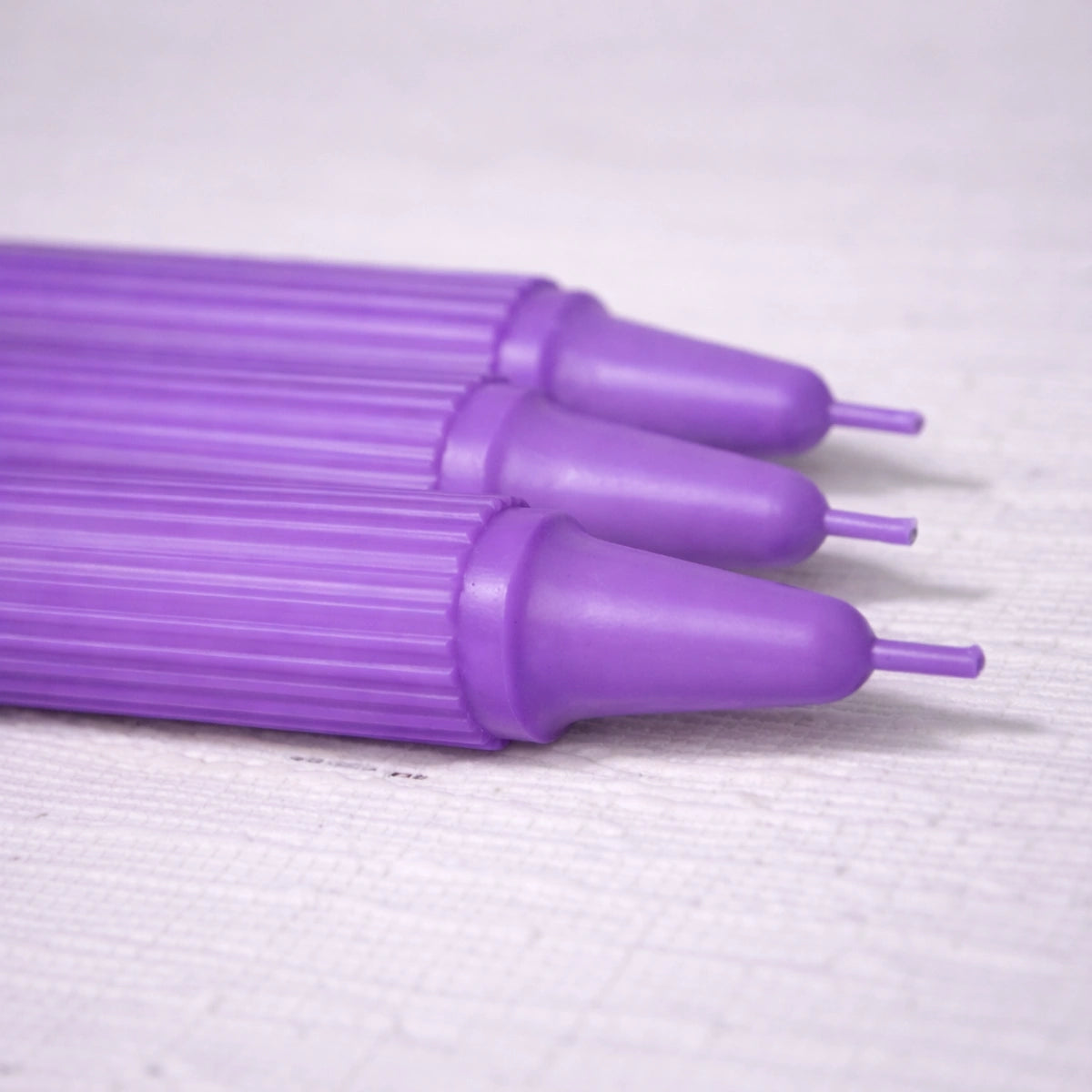 Crown-Forming Taper Candle Purple